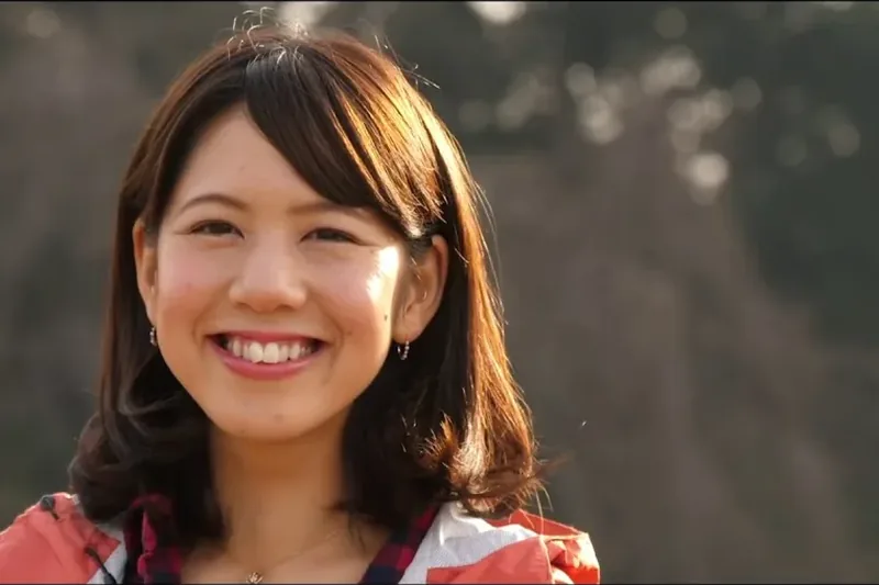 新規就農をテーマにした映像の一場面、笑顔で話す女性